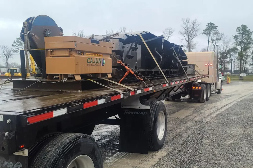 ferrara transport services baton rouge flatbed hauling crane parts for cajun constructions